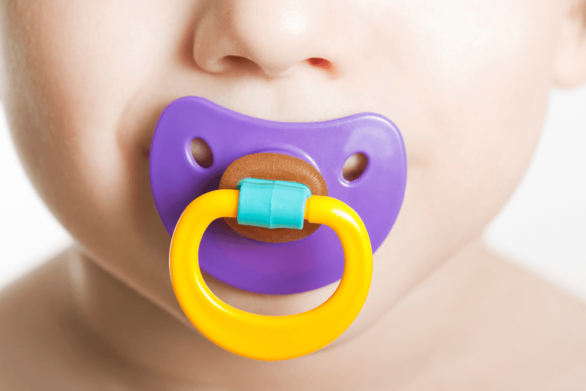 Newborn baby using pacifier safely